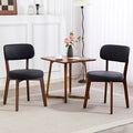Yilaywain Mid-Century Modern Dining Chairs with Rubberwood Frame, Black Faux Leather Upholstered, 250 LBS Weight Capacity, Anti-Slip Protectors (Black)